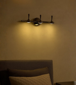 Pearl Black designer wall light with adjustable heads for ambient lighting