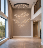 Luxury crystal blossom chandelier with gold branches installed in double height