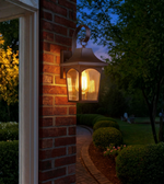 Elegant metal and glass outdoor wall lantern for home entrances.