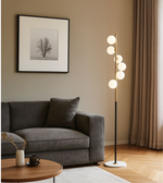 Modern floor lamp with multiple frosted glass globes.