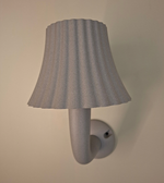 Modern grey LED outdoor wall light with textured fabric-style shade mounted on a wall