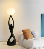 Modern feminine sculpture floor lamp by Daya Worldwide, featuring a sleek, artistic statue design with integrated lighting.