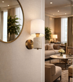 modern brass and stone wall sconce with fabric shade in living room