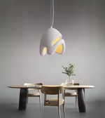 Cloud Drift Foam Pendant in white sculptural form illuminating a modern dining and bedroom interior.