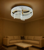 Lustra Wave ceiling light with crystal-detailed glass panels illuminating modern beige lounge.