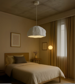 Drift White Foam Pendant with cloud-like sculptural shape above dining and café interiors.