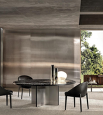 Round obsidian dining table by Daya Worldwide with sleek black stone surface and modern design for elegant dining spaces.