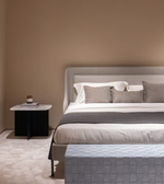 Daya Worldwide Luna Curve upholstered bed with plush fabric and curved headboard, modern bedroom furniture in soft neutral tones.