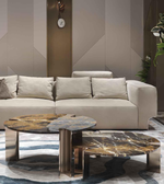 Set of two marble coffee tables featuring sleek white marble tops and modern black metal legs, by Daya Worldwide.
