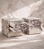 Marble nightstand bedside table with a sleek design, featuring a smooth marble surface and minimalist style from Daya Worldwide.