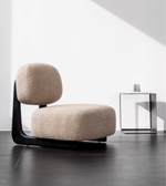 Daya Worldwide Mira lounge chair with sleek design, featuring plush upholstery and modern wooden legs for stylish comfort.