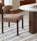 Daya Worldwide Ova Dining Table with sleek wooden surface and modern design, set against a neutral background.