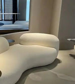 Daya Worldwide Cove Curve Sofa featuring a sleek, modern design with plush cushions and curved silhouette in a contemporary living room setting.