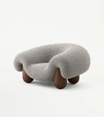Plush sculptural lounge chair by Daya Worldwide featuring a modern, cushioned design ideal for stylish living spaces.