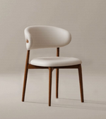 Mid-century dining chair with wooden frame and upholstered seat, showcasing sleek design and modern style.