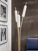 Luxury sculptural floor lamp in contemporary living room setting