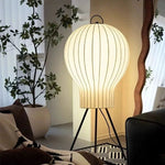 Ambient lantern floor lamp enhancing cozy living room decor