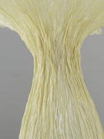 Close-up of textured organic surface on sculptural floor lamp