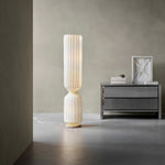 Designer ribbed floor lamp placed in contemporary interior