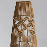 Tall woven floor lamp with geometric pattern and soft warm lighting