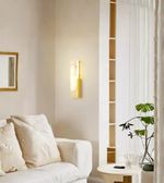 Luxury marble wall sconce illuminating a modern living room