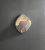 Modern wall light fixture on a gray wall