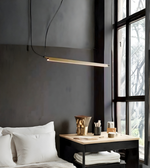 Modern bedroom with a bed, nightstand, and pendant light.