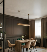 Modern dining room with wooden table and chairs, pendant lights, and a window with curtains.