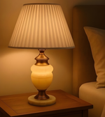 Classic bedside table lamp with pleated shade and warm ambient glow