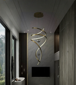Modern interior with a gold spiral pendant light fixture.