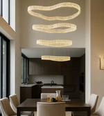 Modern kitchen with a stylish chandelier and dining table.