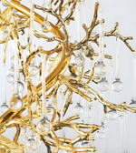Gold chandelier with clear glass balls on a white background