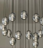 Chandelier with multiple spherical lights on a neutral background