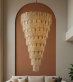 Chandelier hanging in a room with a neutral color palette