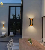 Modern outdoor setting with wall lights on a building exterior