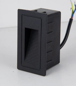 Black rectangular electronic component with wiring on a white background