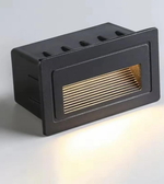 Black rectangular outdoor light fixture on a white background
