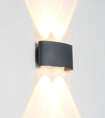 Modern wall-mounted light fixture on a white wall