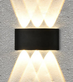 Modern wall-mounted light fixture on a concrete wall