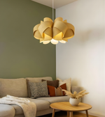 Modern living room with a decorative yellow ceiling light fixture.