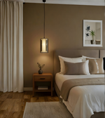 Cozy bedroom with a bed, nightstand, and wall art.