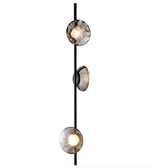 Modern pendant light with three round glass shades on a white background