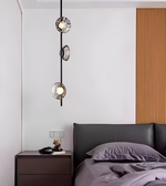 Modern bedroom with a bed, nightstand, and decorative wall light fixture.