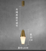Gold pendant light with measurements on a gray background