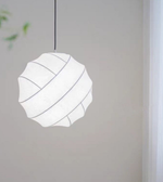 Modern pendant light with geometric design on a neutral background