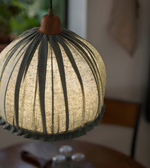 Textured spherical pendant light with a blurred background