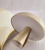 Close-up of brushed gold dome shade table lamp