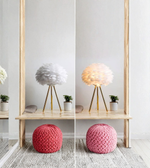 Decorative feather lamp on bedside table with warm ambient light