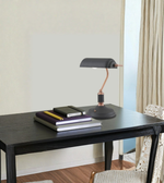 Modern banker desk lamp styled on study table with books