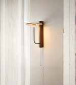 Contemporary wall sconce with slim vertical design and soft glow